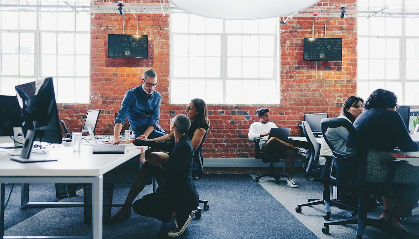 Office team image for article on what a web design agency is and why your business needs one