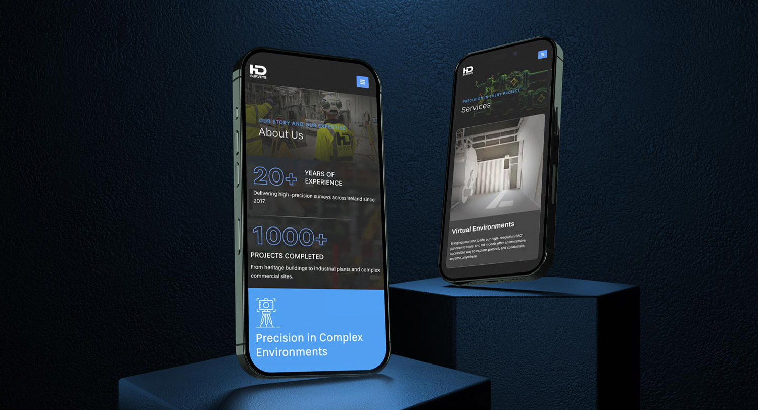 Two smartphones display a company’s website featuring B2B Web Design, information about years of experience, completed projects, and virtual environment services, set against a dark blue textured background.